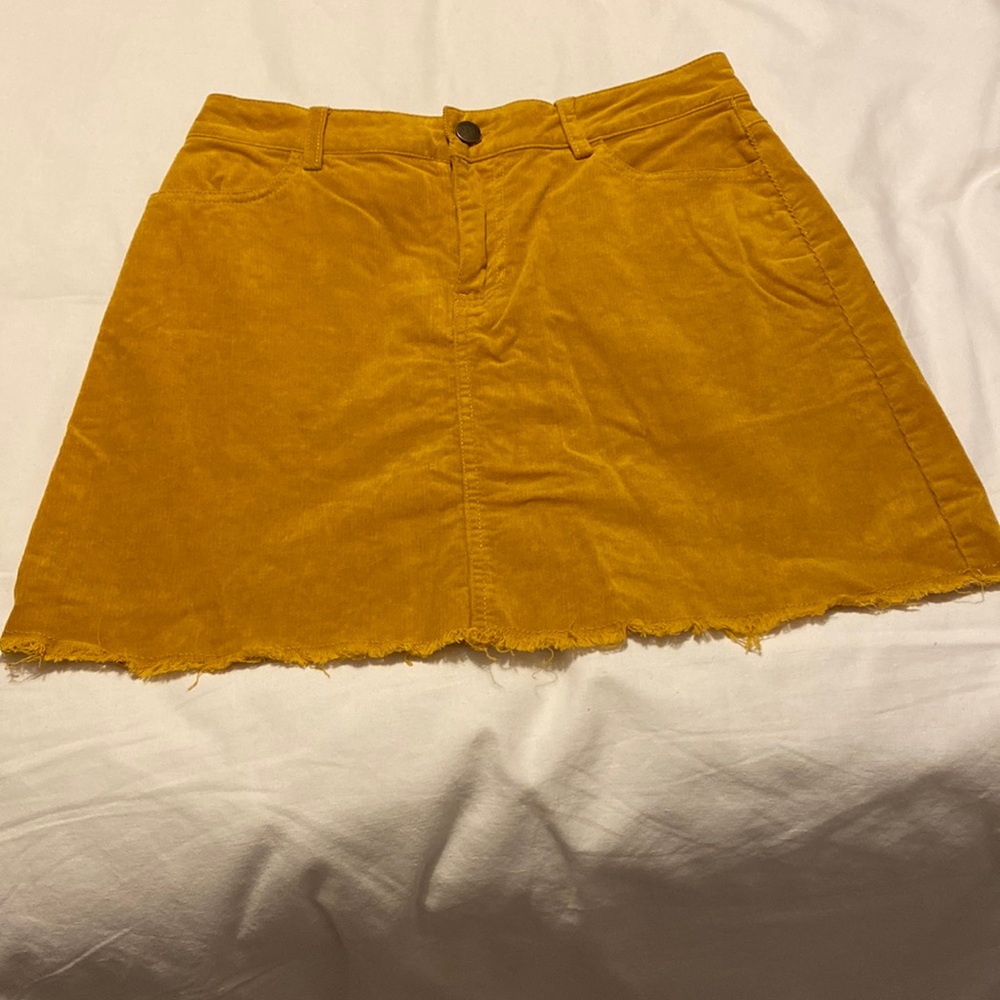 Corduroy skirt  pockets  zipper button mustard colored. Raw hem